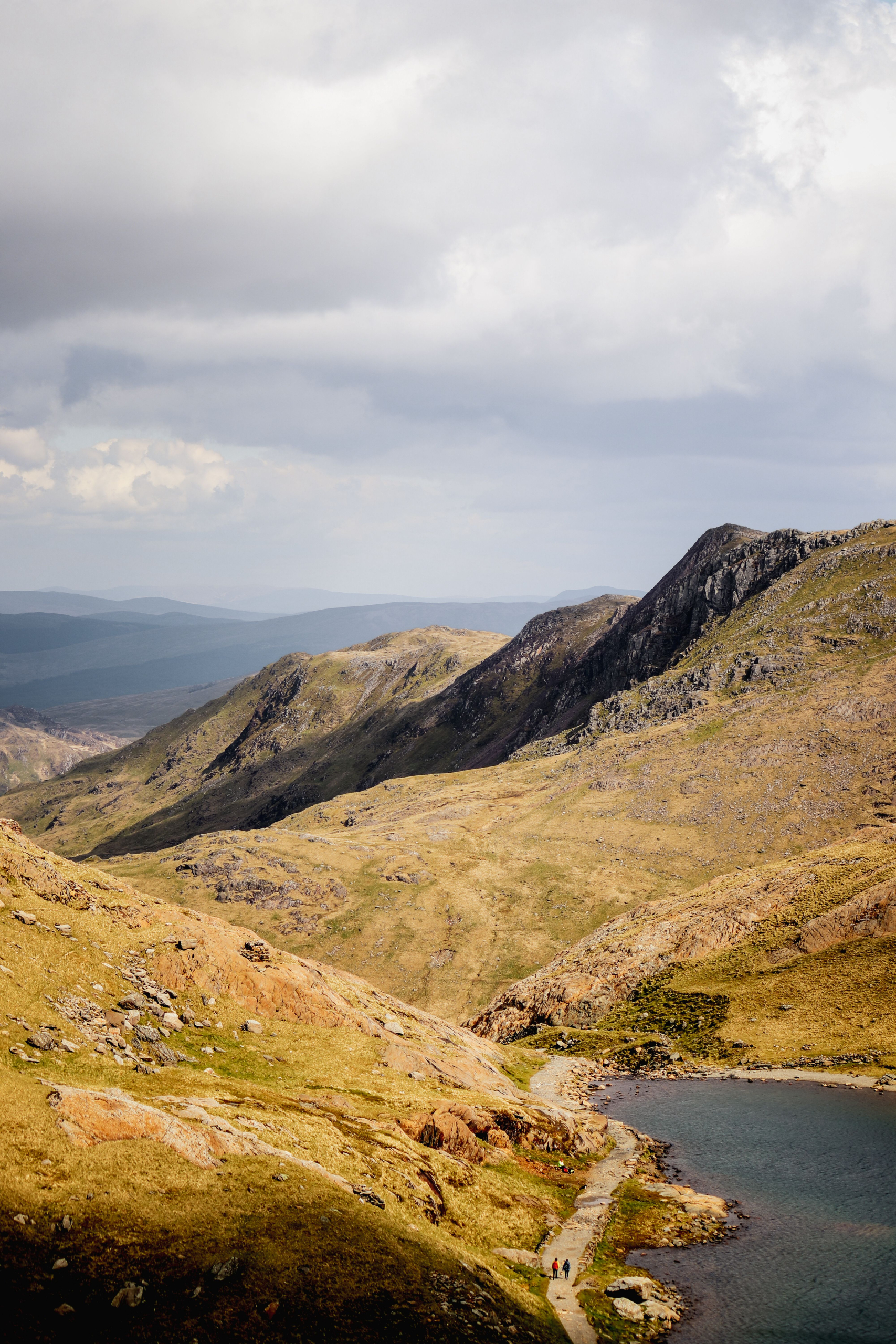 Mountain valley with a lake and walking path in Eryri National Park (Snowdonia), Wales